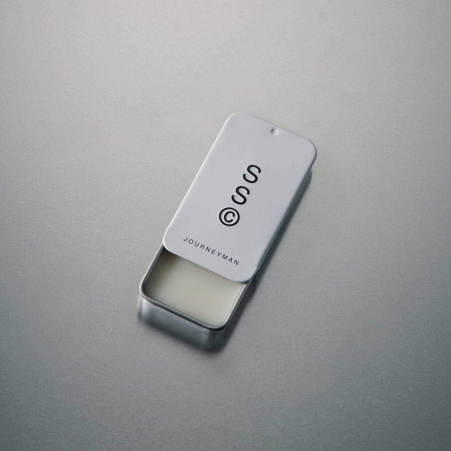 Solid State solid cologne balm with a smooth, wax-like texture that melts gently into the skin