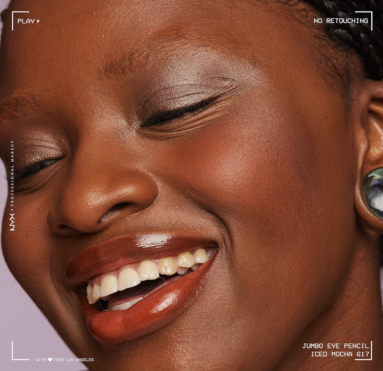 Close-up of a woman's face with makeup, featuring NYX Professional Makeup branding.