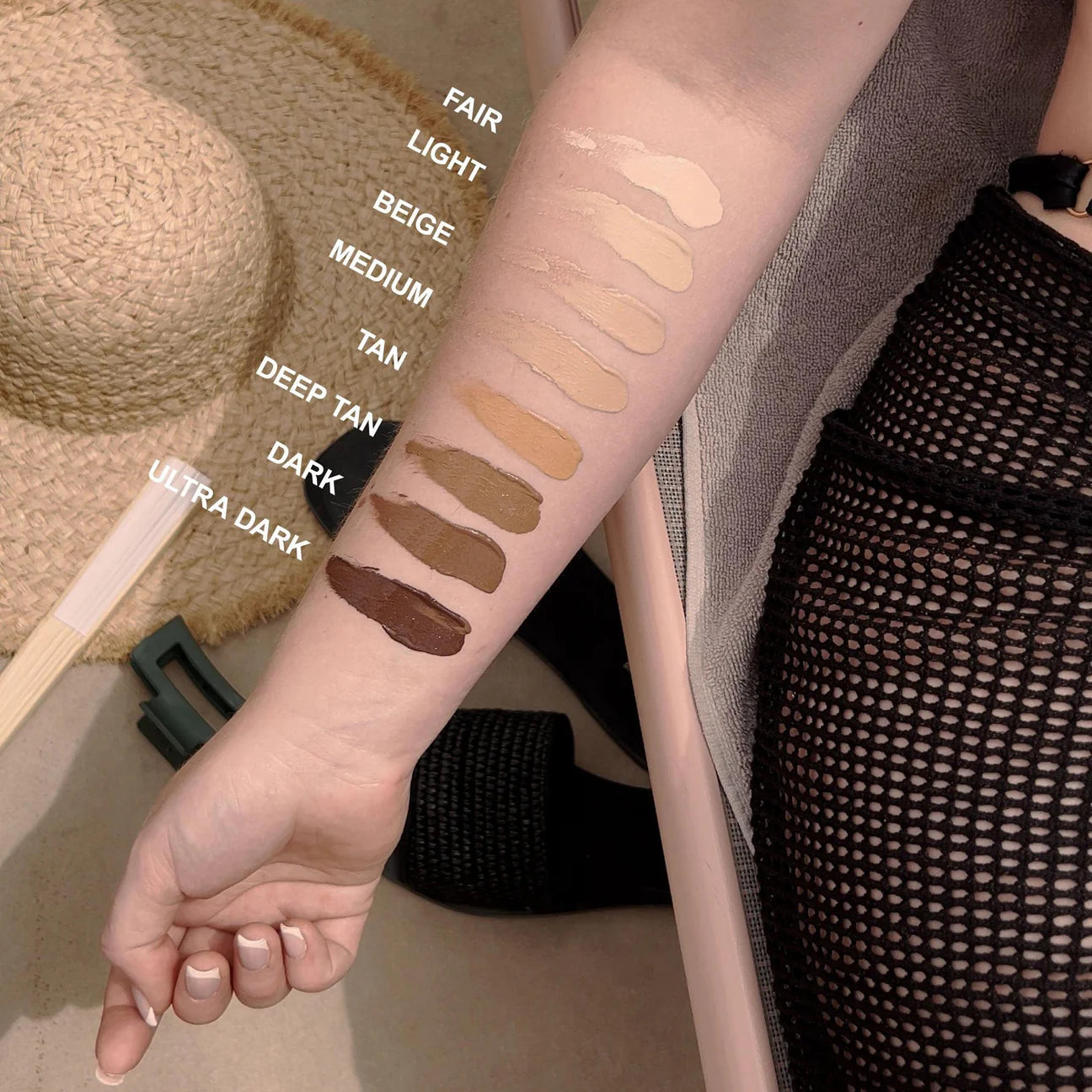 technic concealer serum infused with vitamin E, hyaluronic acid, glycerin swatches on a person's arm with color names labeled