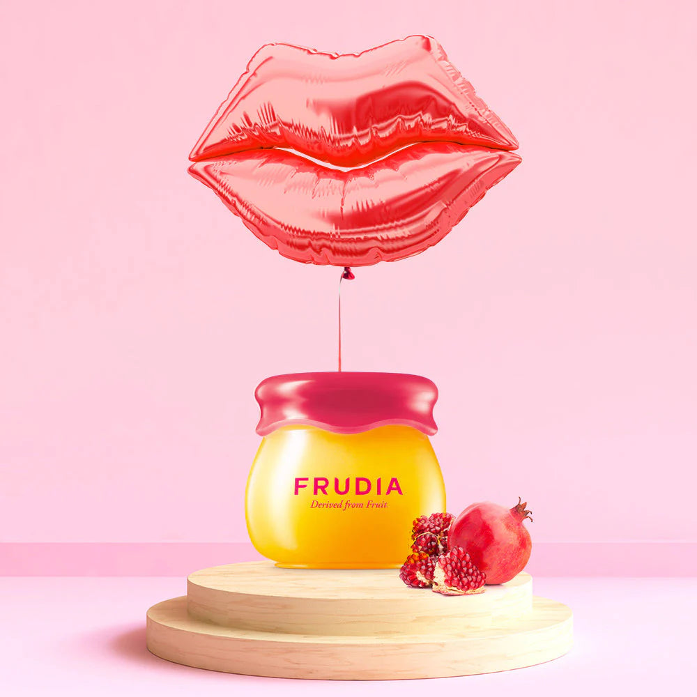 Frudia Pomegranate Honey 3 in 1 Lip Balm 10ml applied to lips softening dry lips with smooth glossy finish and natural glow
