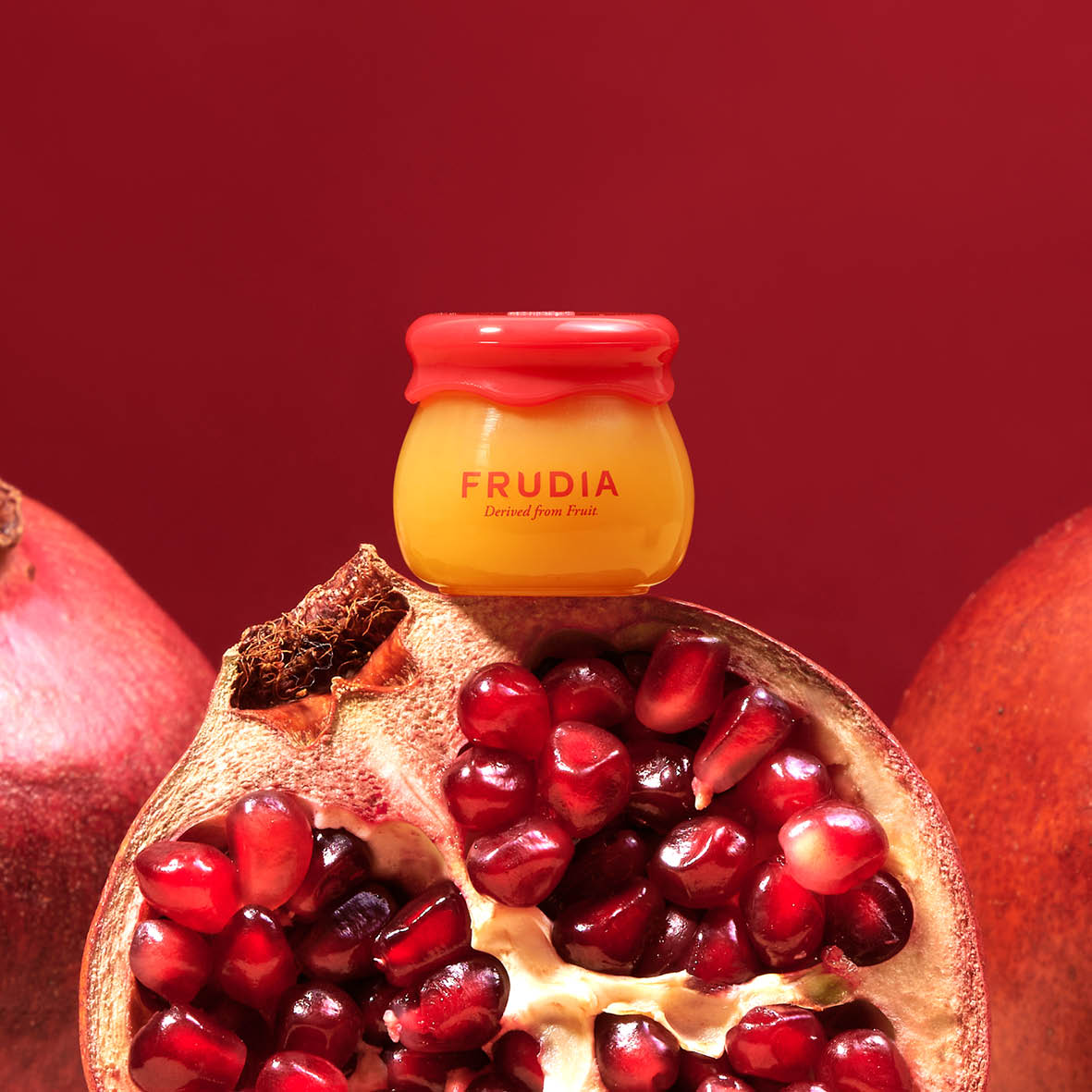 Frudia Pomegranate Honey 3 in 1 Lip Balm 10ml with pomegranate extract and honey to hydrate smooth and enhance lip glow