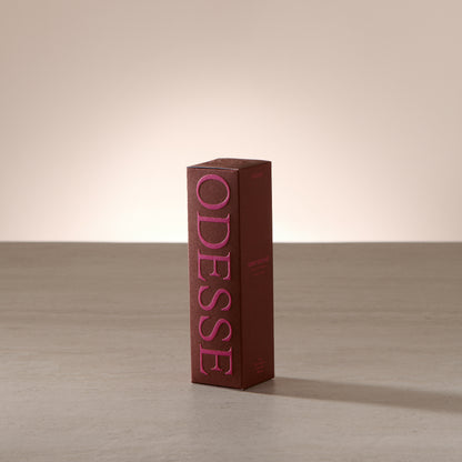 Odesse Deep Orchid 10ml extrait de parfum displayed in a soft, light-filled setting with a refined, portable format