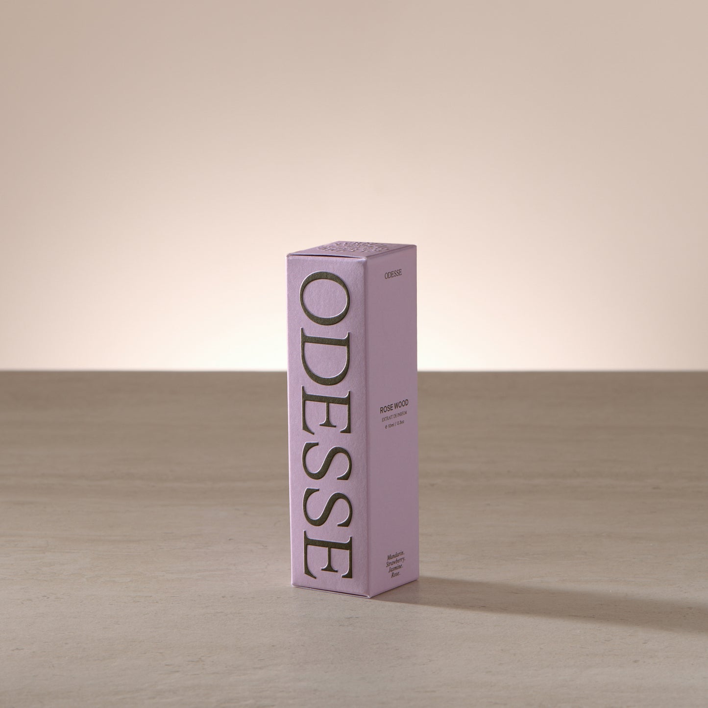Odesse Rose Wood 10ml extrait de parfum displayed in a soft, light-filled setting with a refined, portable format