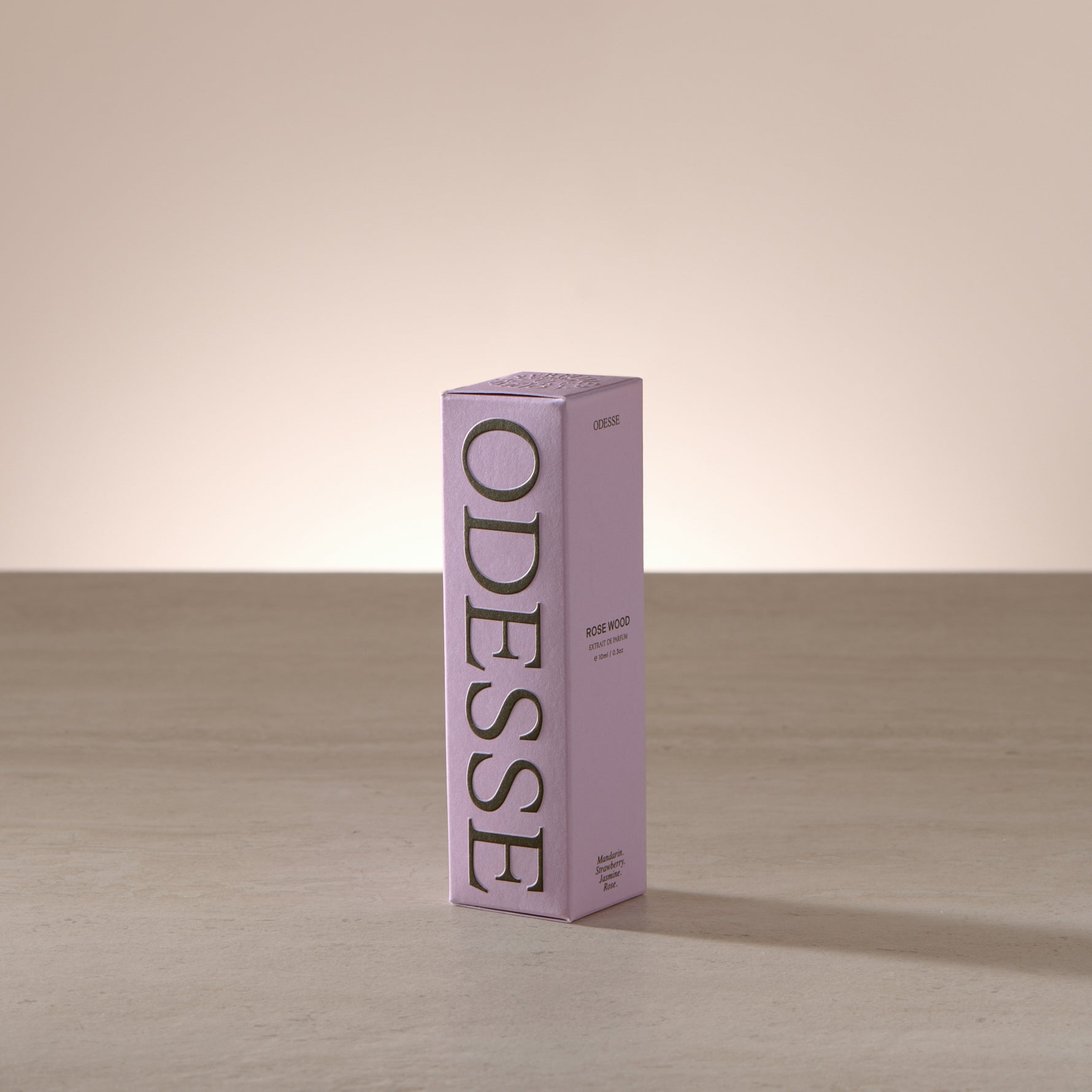 Odesse Rose Wood 10ml extrait de parfum displayed in a soft, light-filled setting with a refined, portable format