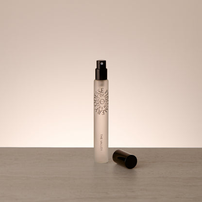 Odesse The Valley Extrait de Parfum 10ml travel-size fragrance styled in a minimal, editorial composition highlighting refined portability
