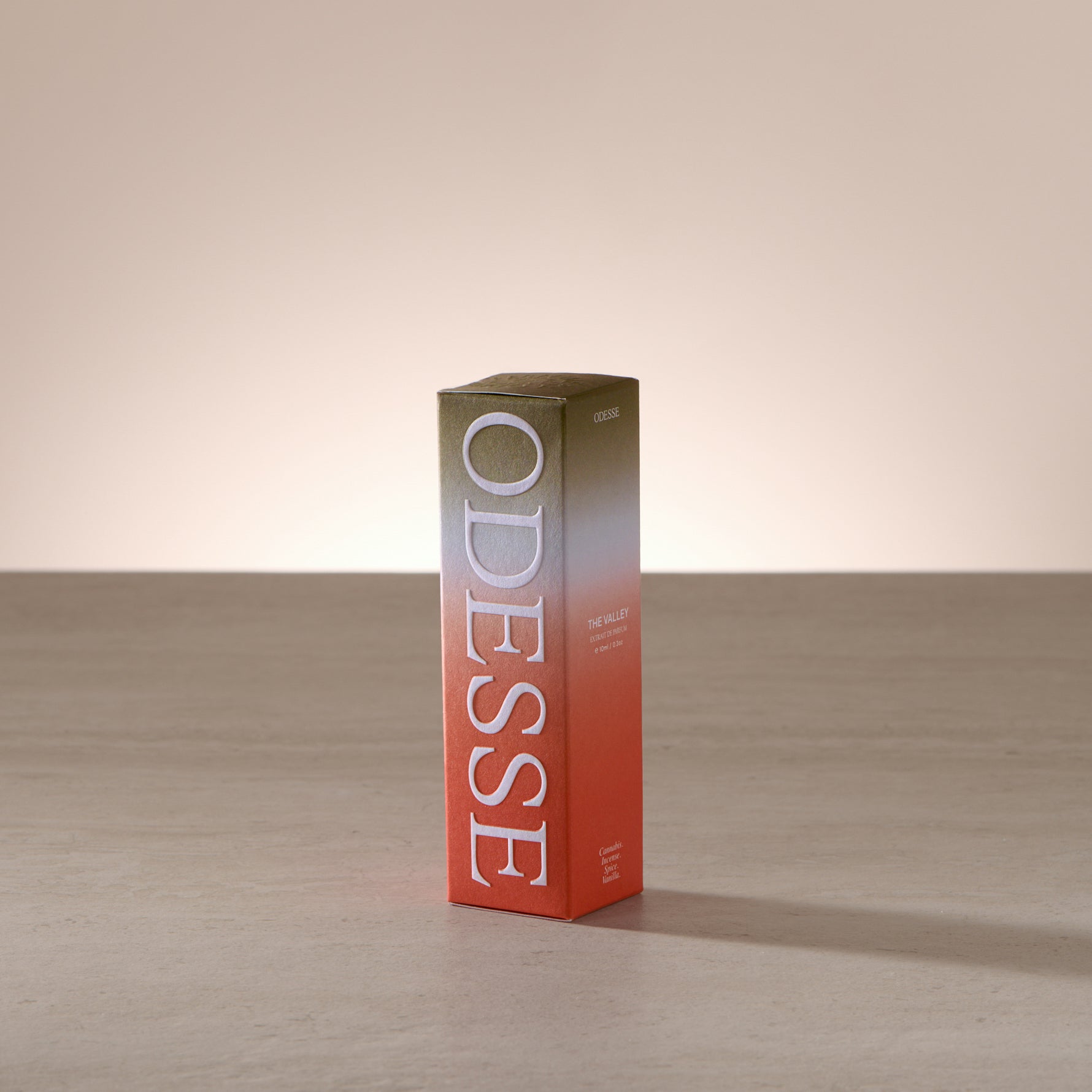 Odesse The Valley 10ml extrait de parfum displayed in a clean, light-filled setting with a focus on compact luxury