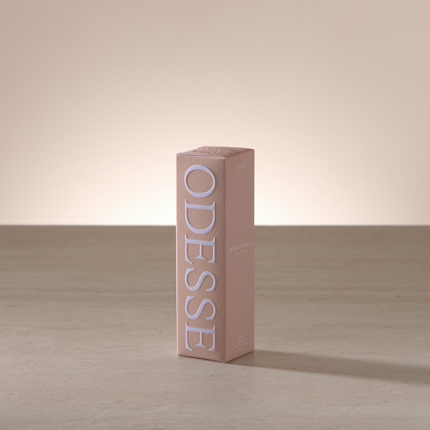 Odesse 10ml mini fragrance styled with warm, creamy accents reflecting a vanilla scent profile