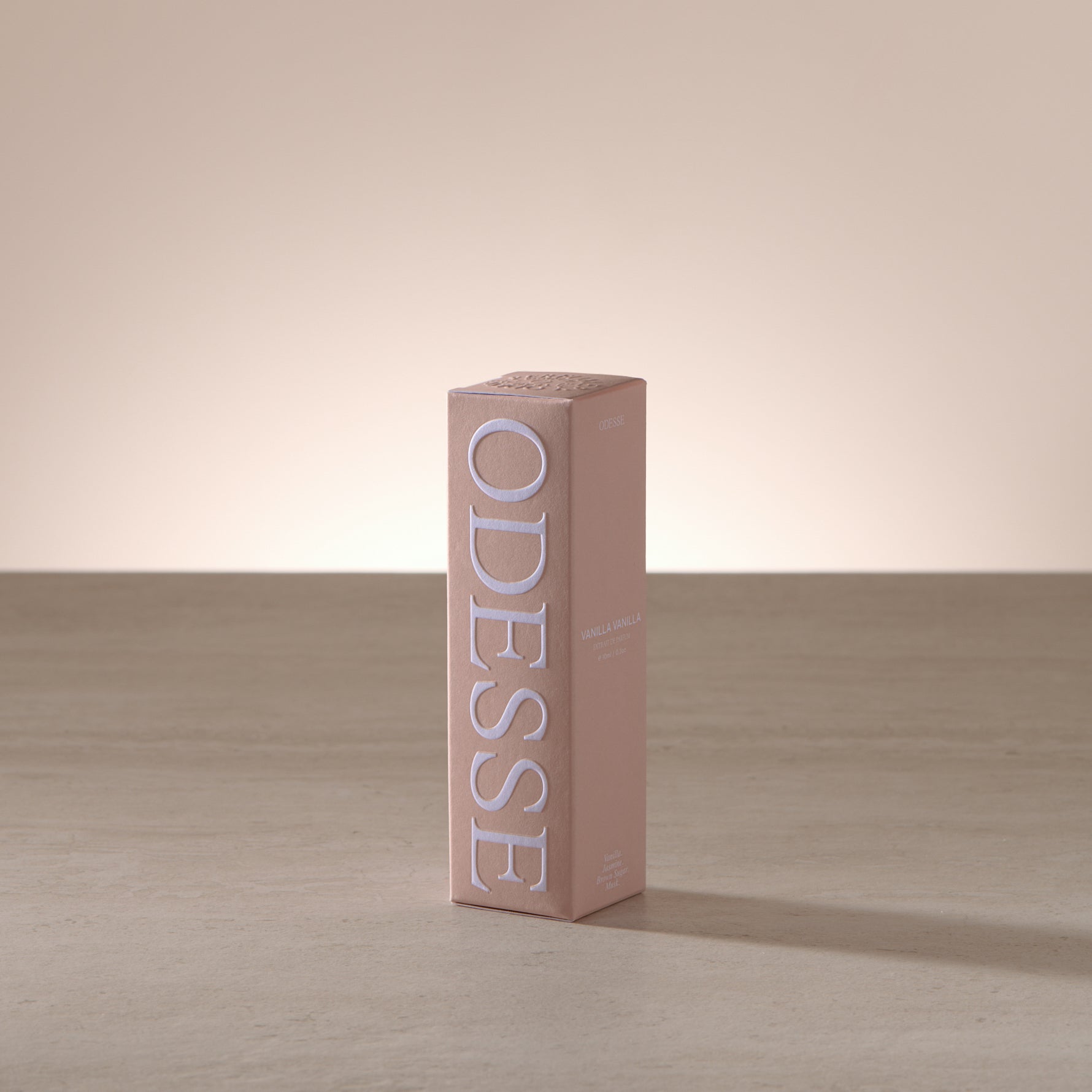 Odesse 10ml mini fragrance styled with warm, creamy accents reflecting a vanilla scent profile