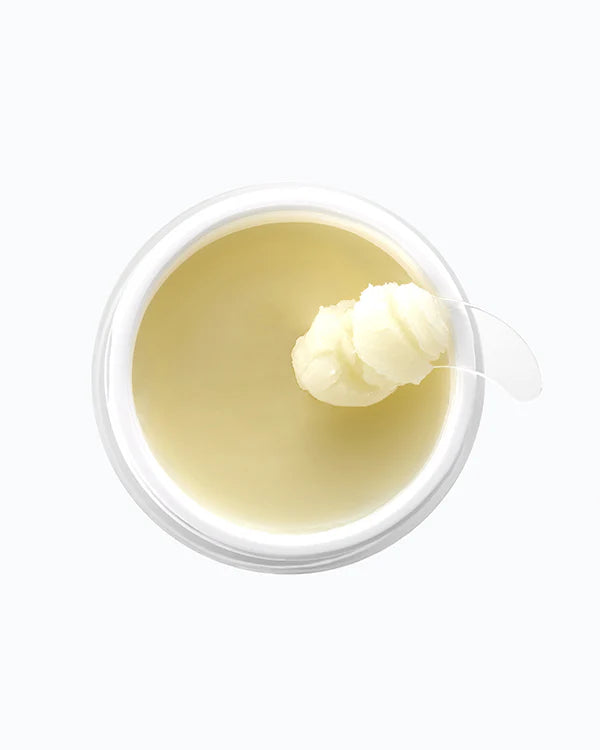 Depology Opuntia C Relief Cleansing Balm 100ml cleansing balm scooped out with applicator displaying rich texture and melt effect