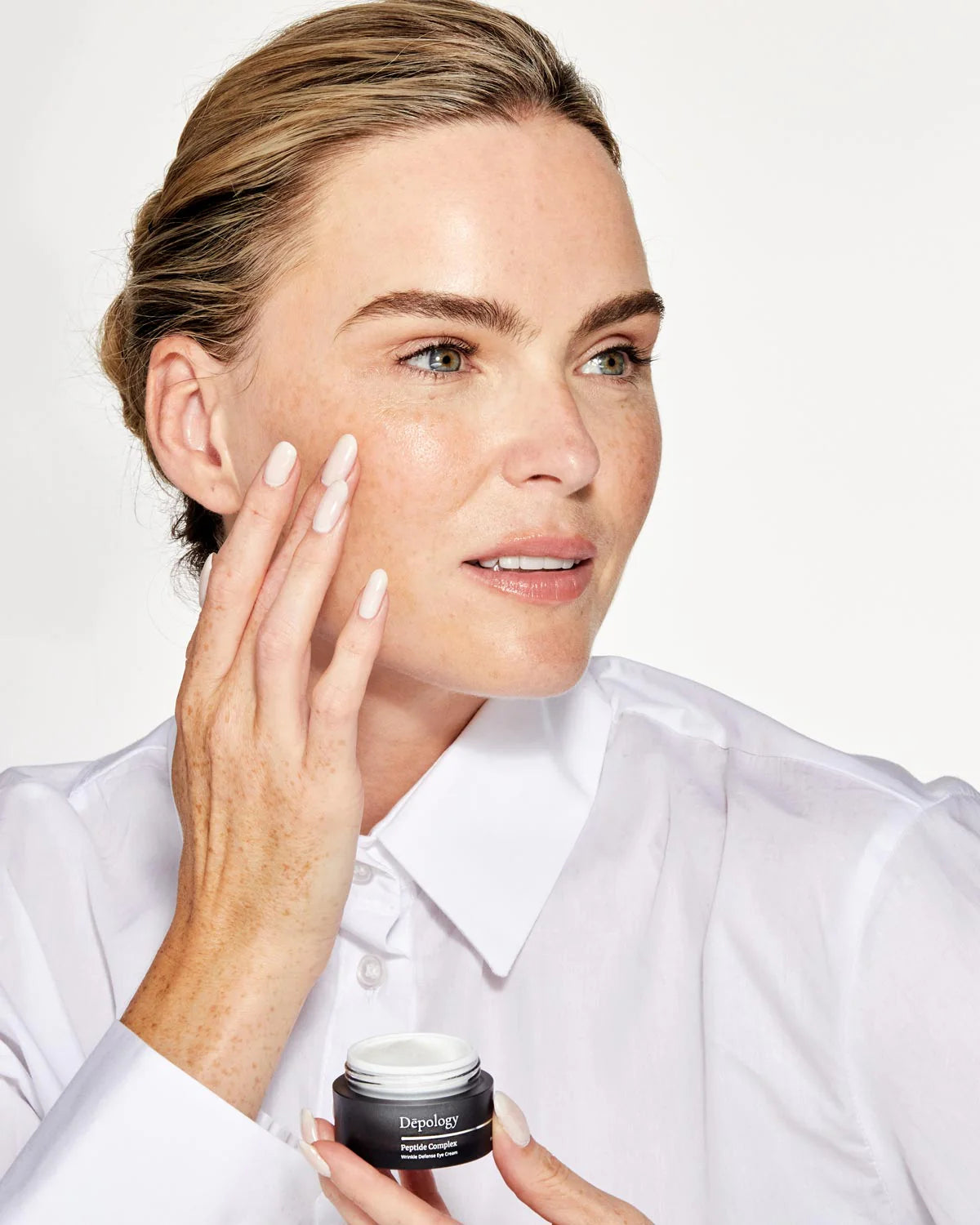 Depology Peptide Complex Wrinkle Defense Eye Cream 15ml applied under eyes for smoothing wrinkles hydrating and firming skin