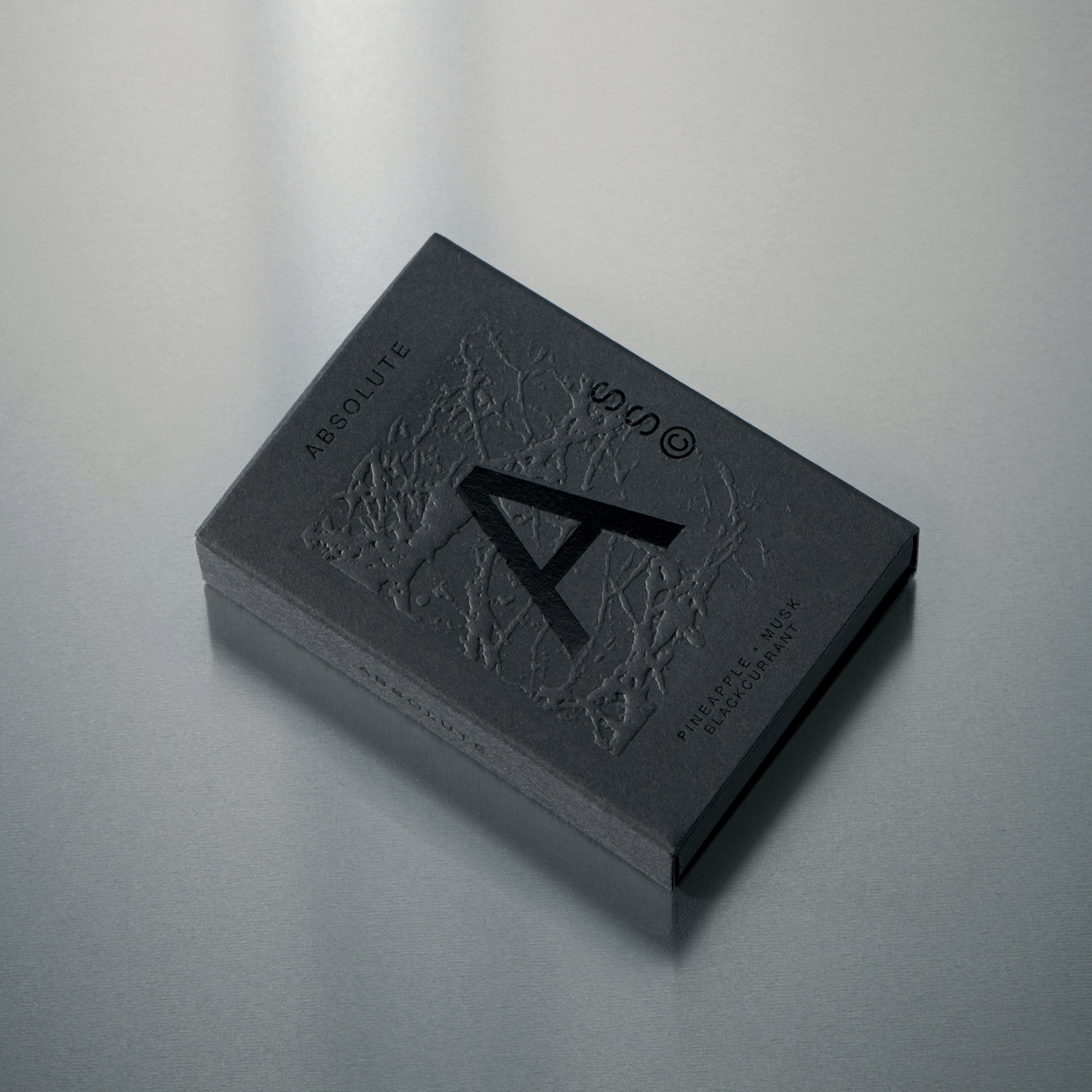 Solid State Absolute solid cologne delivering a deeper, more grounded scent with a smooth, wearable profile