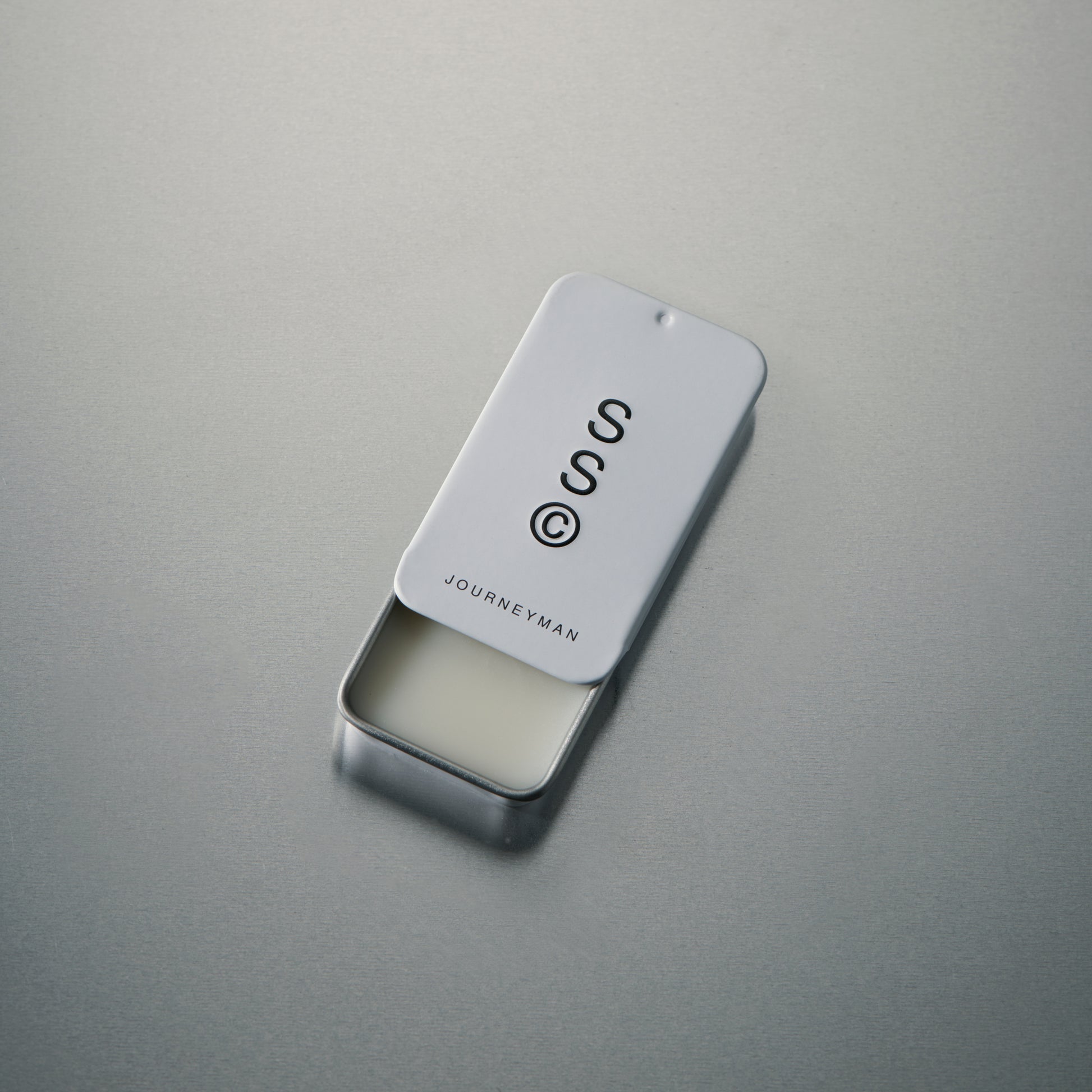 Solid State solid cologne balm with a smooth, wax-like texture that melts gently into the skin