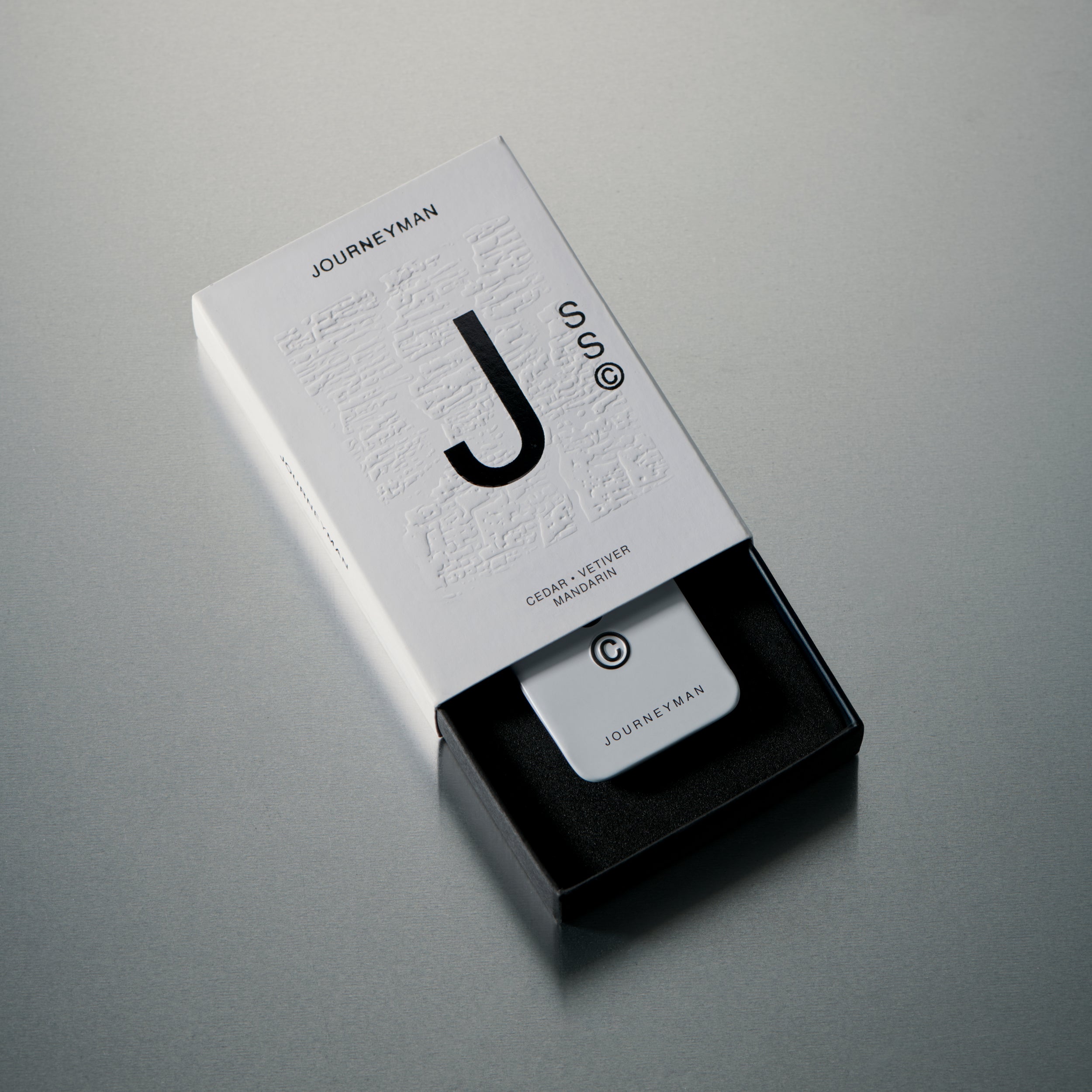 Solid State Journeyman solid cologne formulated for refined fragrance delivery with a smooth, wax-based texture