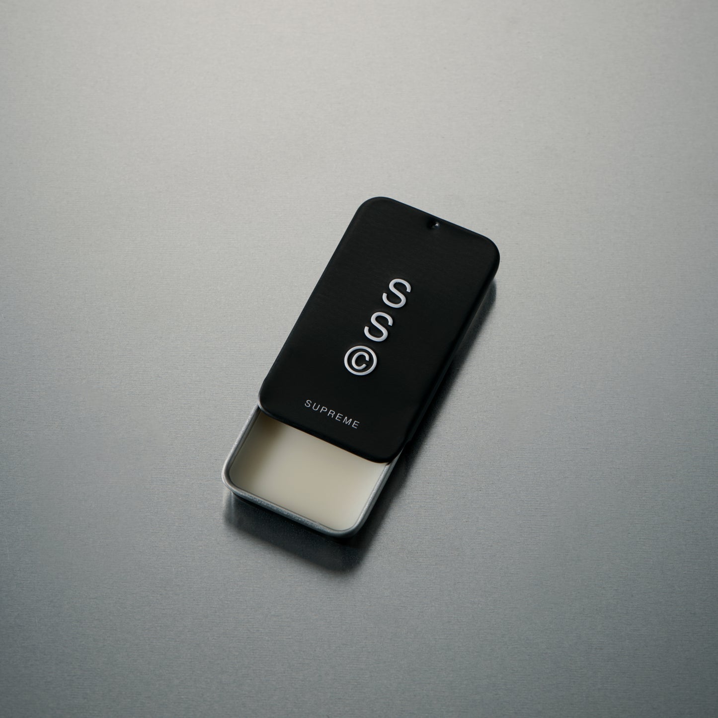 Solid State fragrance balm designed to deliver a refined scent in a discreet, portable format