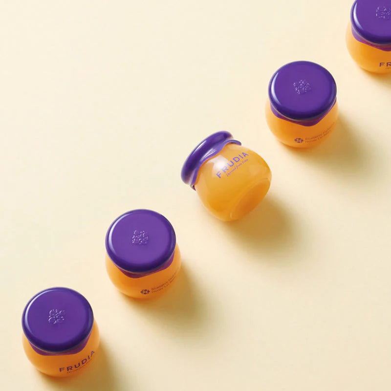 FRUDIA nourishing lip treatment 10ml delivering lasting moisture and a soft, natural sheen