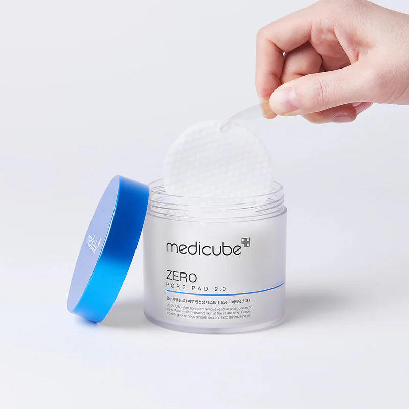 MEDICUBE Zero Pore Pad swiping across skin for gentle exfoliation and visible smoothing