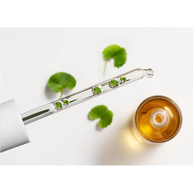 SKIN1004 Madagascar Centella Ampoule 100ml serum captured in dropper showing smooth weightless consistency