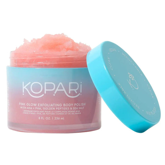 Kopari pink glow exfoliating body polish with a blue lid on a white background