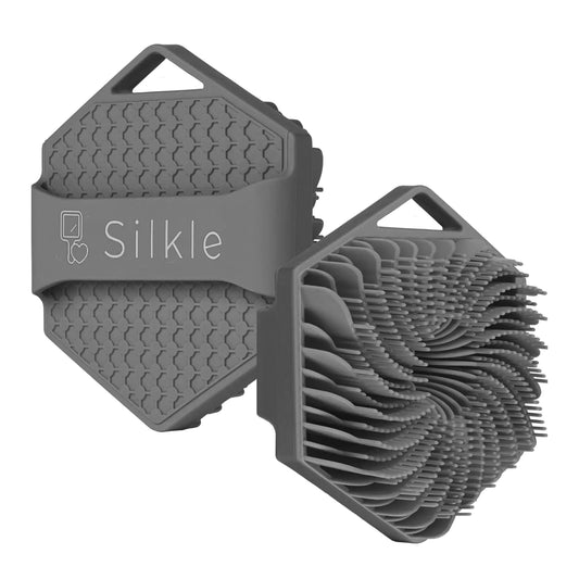 Silkle grooming tool with textured design on a white background